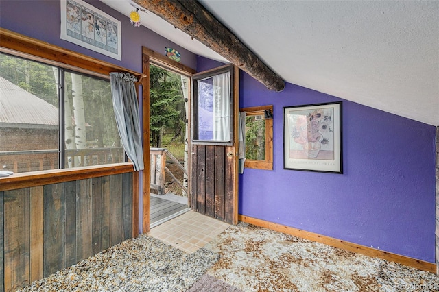 10419 Christopher Dr, Conifer, CO 80433 - entryway with vaulted ceiling, a textured wall, and a textured ceiling