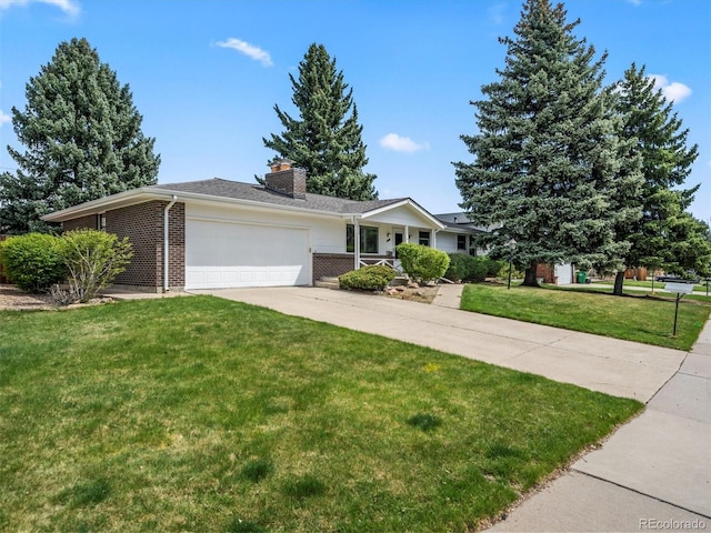 ranch-style house with a garage, concrete driveway, a chimney, a front yard, and brick siding