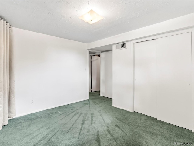 unfurnished bedroom featuring a closet, carpet, visible vents, and baseboards