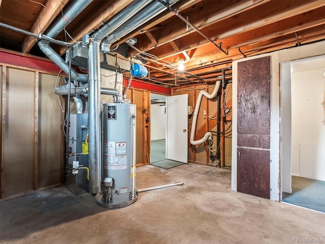 unfinished below grade area featuring water heater