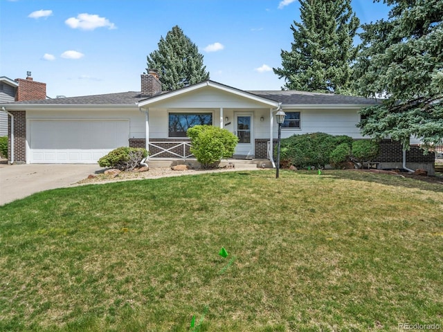 ranch-style home featuring a front lawn, driveway, a chimney, brick siding, and a garage