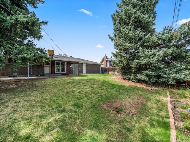 view of yard with fence and a patio area