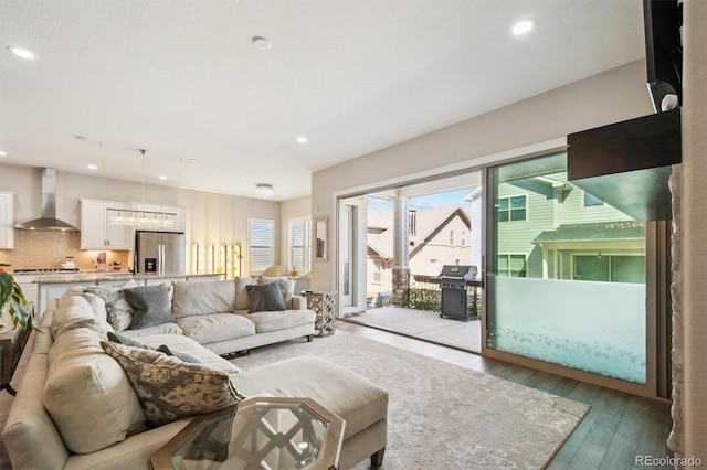 living room with recessed lighting and hardwood / wood-style floors