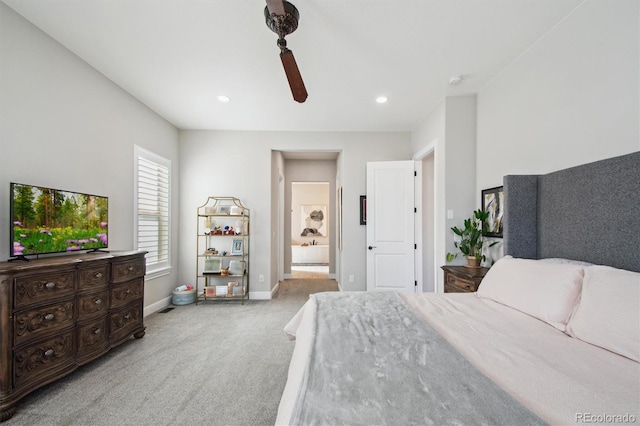 carpeted bedroom featuring recessed lighting, baseboards, ceiling fan, and ensuite bathroom