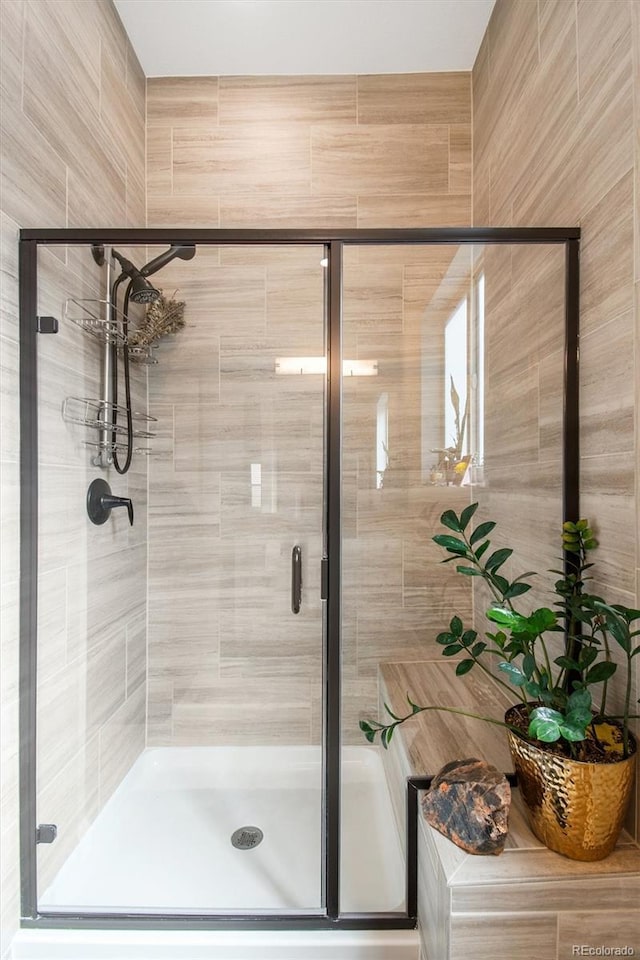 full bathroom featuring a stall shower
