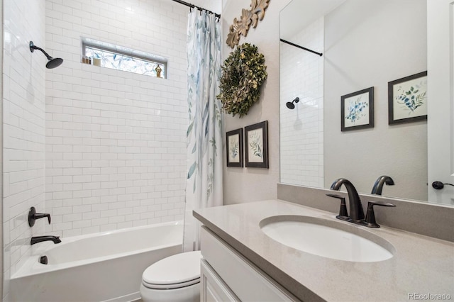 full bathroom with vanity, shower / bath combo with shower curtain, and toilet