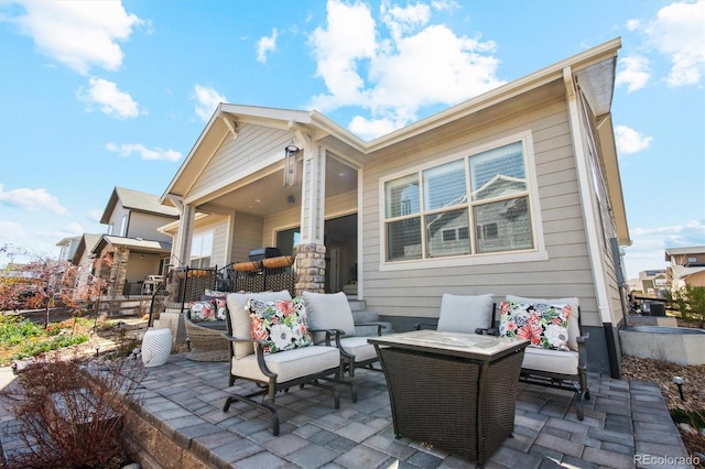 14160 Ivanhoe St, Thornton, CO 80602 - rear view of property with an outdoor living space, a patio area, and fence