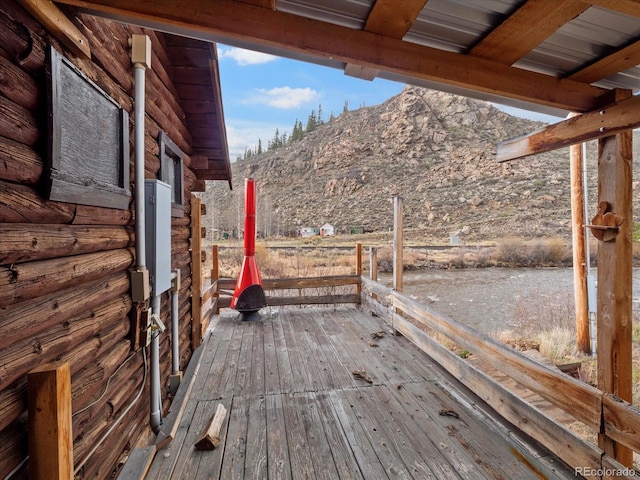 wooden terrace featuring a mountain view