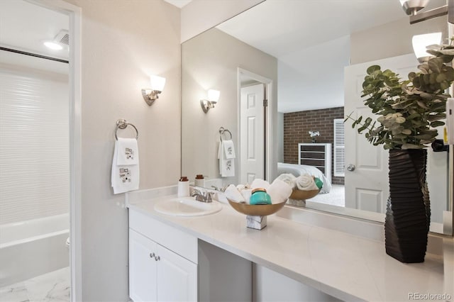 2880 S Locust St Unit 305N, Denver, CO 80222 - full bathroom with vanity and marble look tile flooring