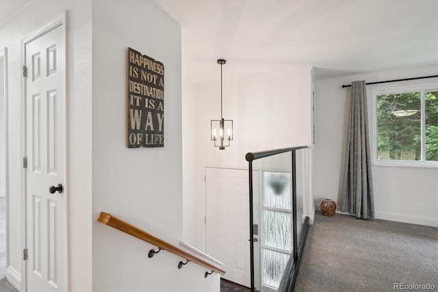 2843 S Otis St, Denver, CO 80227 - entrance foyer with carpet flooring and a chandelier