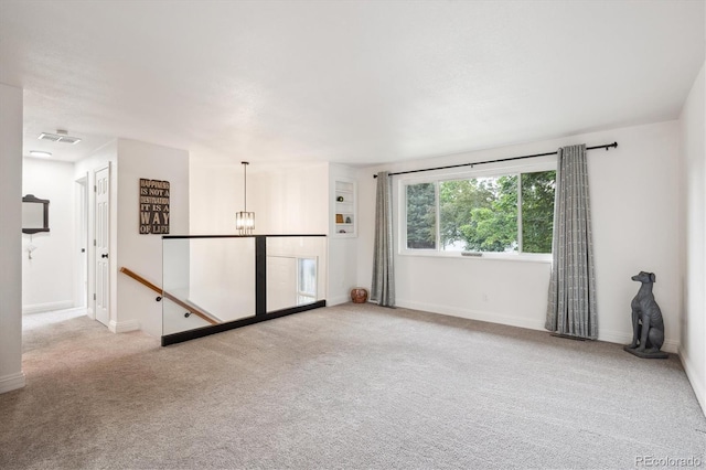 2843 S Otis St, Denver, CO 80227 - unfurnished room with carpet floors and a chandelier