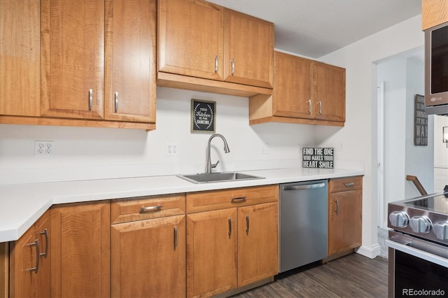 2843 S Otis St, Denver, CO 80227 - kitchen featuring stainless steel appliances, dark wood-style floors, light countertops, and brown cabinetry