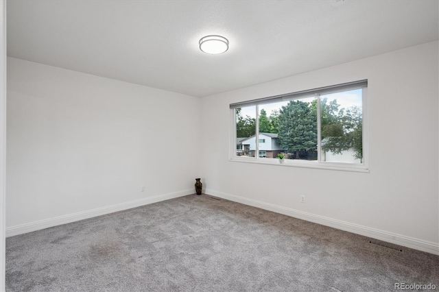 2843 S Otis St, Denver, CO 80227 - carpeted empty room featuring baseboards