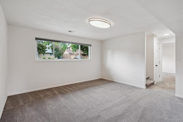 2843 S Otis St, Denver, CO 80227 - spare room with carpet floors and a textured ceiling