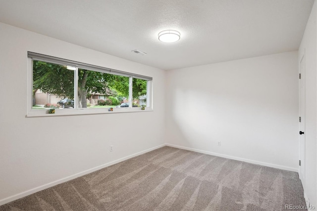 2843 S Otis St, Denver, CO 80227 - spare room featuring carpet and a textured ceiling