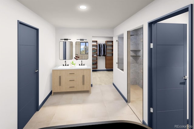 bathroom featuring double vanity, walk in shower, a sink, baseboards, and recessed lighting