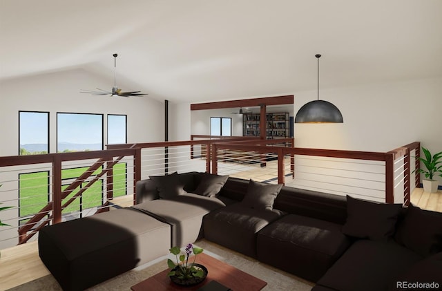 living area with a ceiling fan and lofted ceiling