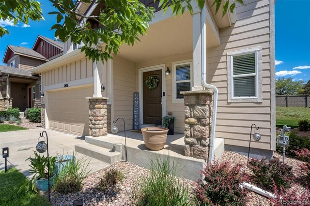 2456 Sierra Springs Dr, Colorado Springs, CO 80916 - view of front of house featuring a garage, driveway, board and batten siding, and stone siding