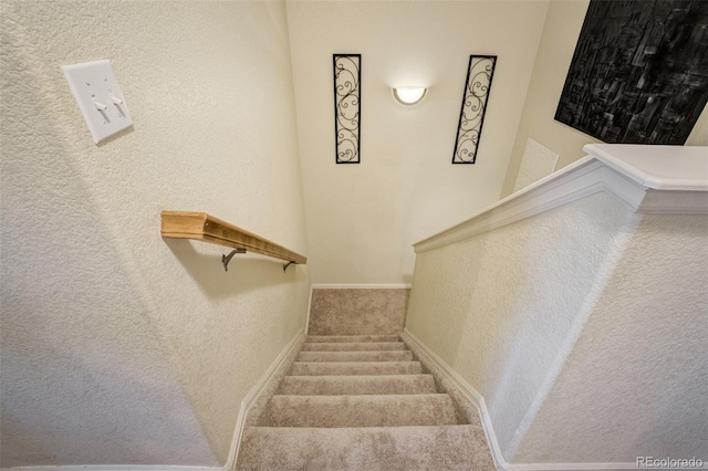 2456 Sierra Springs Dr, Colorado Springs, CO 80916 - stairs featuring carpet floors and a textured wall