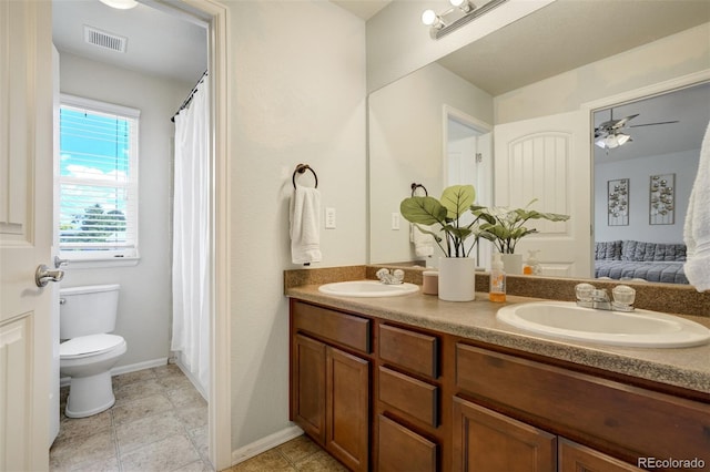 2456 Sierra Springs Dr, Colorado Springs, CO 80916 - ensuite bathroom with double vanity and a ceiling fan