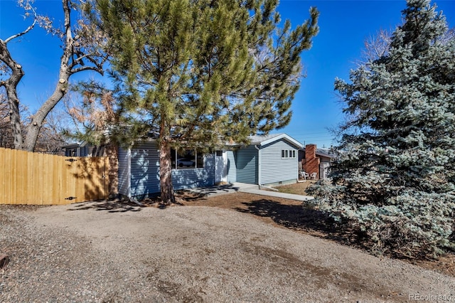 view of front of house with fence