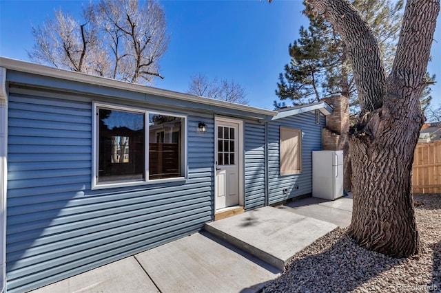 exterior space with fence and a patio