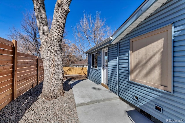 view of patio / terrace featuring fence