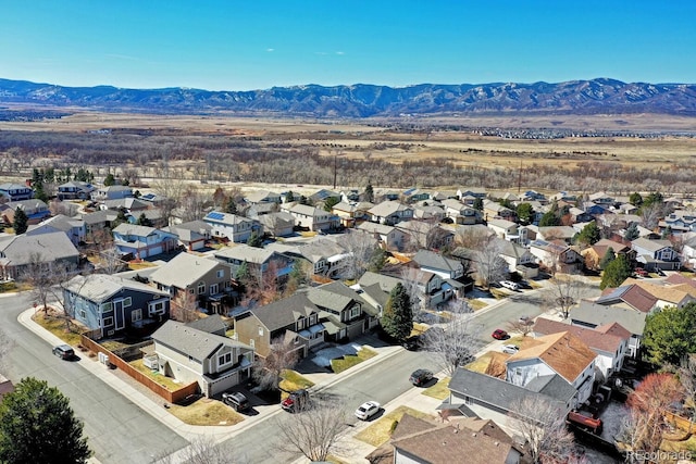 drone / aerial view featuring a mountain view and a residential view