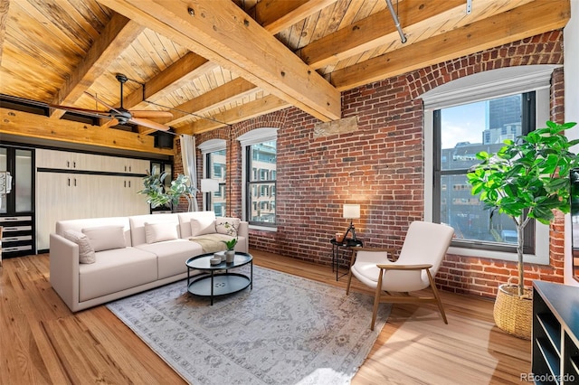 living area with wood ceiling, brick wall, and wood finished floors