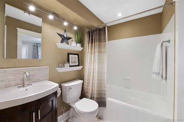 full bathroom featuring shower / bath combo, toilet, and vanity