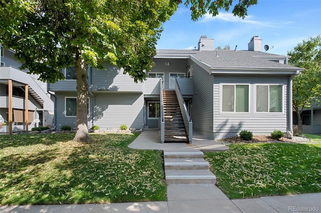 view of front of home with a front yard