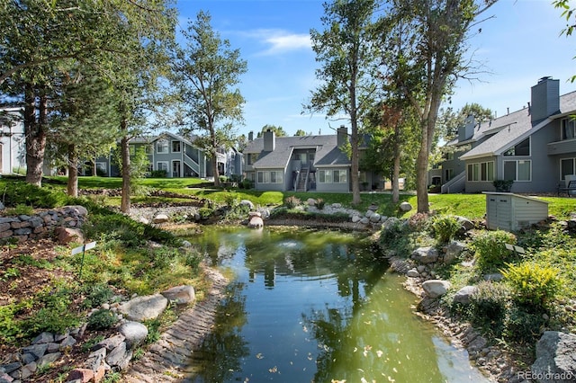 view of home's community featuring a water view