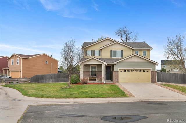 view of front of house with concrete driveway, brick siding, fence, and a front lawn