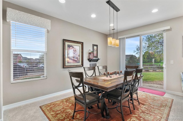 dining room featuring recessed lighting, baseboards, and light colored carpet