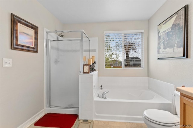 bathroom with a garden tub, tile patterned floors, a stall shower, and vanity
