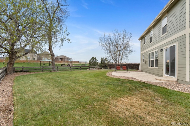 view of yard with a fenced backyard and a patio