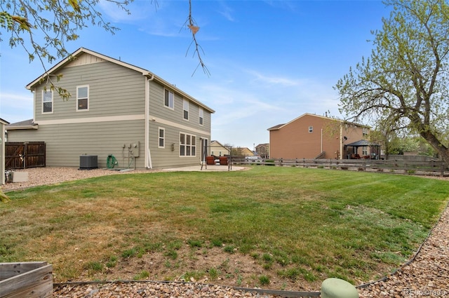 back of house with a patio, a fenced backyard, a lawn, and central air condition unit