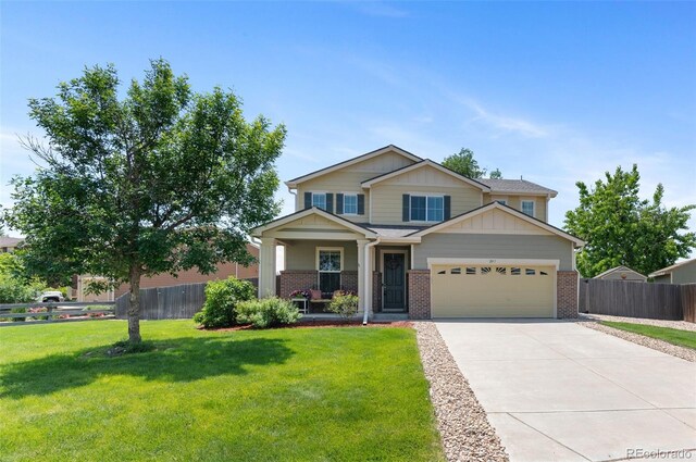 201 Shenandoah Way, Brighton, CO 80603 - craftsman inspired home featuring brick siding, driveway, an attached garage, and covered porch