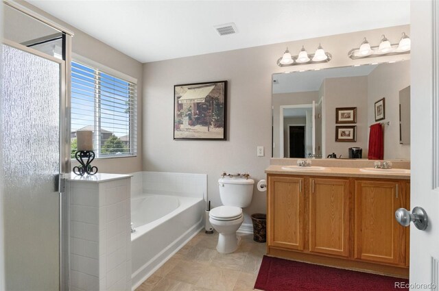201 Shenandoah Way, Brighton, CO 80603 - full bath featuring double vanity, a bath, toilet, and a shower stall