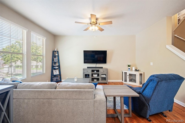 living room with ceiling fan and wood-type flooring