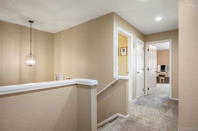 hallway with carpet floors