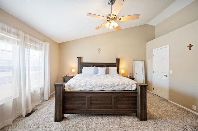 bedroom with light colored carpet, vaulted ceiling, and ceiling fan