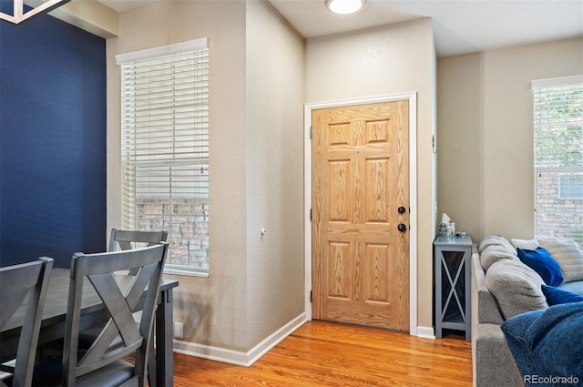 foyer entrance with hardwood / wood-style floors