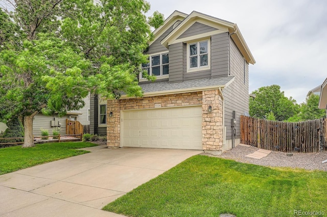 5136 S Ceylon St, Centennial, CO 80015 - view of front of home featuring a garage, stone siding, and concrete driveway