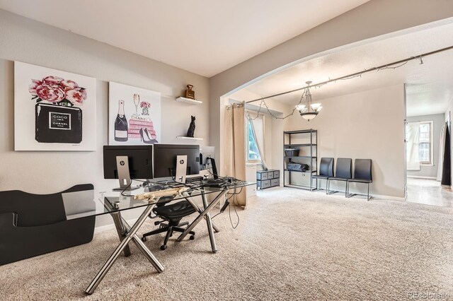 5136 S Ceylon St, Centennial, CO 80015 - carpeted office space featuring a chandelier and arched walkways