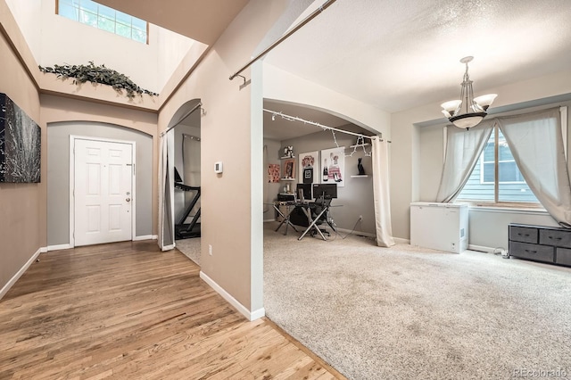 5136 S Ceylon St, Centennial, CO 80015 - entrance foyer with arched walkways, plenty of natural light, and a chandelier