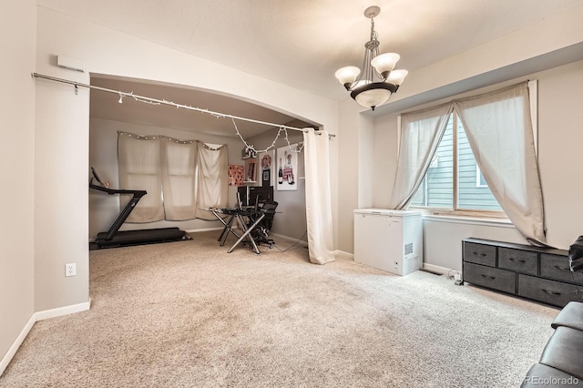 5136 S Ceylon St, Centennial, CO 80015 - bedroom featuring fridge, carpet, a chandelier, and arched walkways