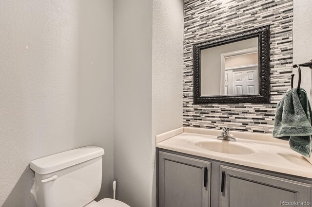 5136 S Ceylon St, Centennial, CO 80015 - half bathroom with decorative backsplash and vanity