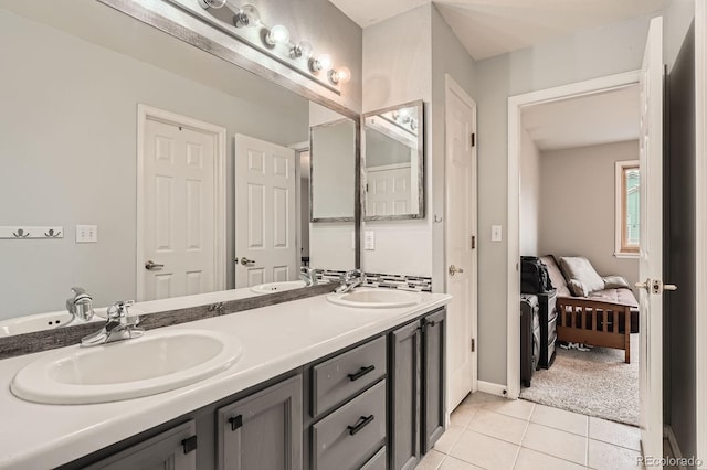 5136 S Ceylon St, Centennial, CO 80015 - ensuite bathroom with double vanity and tile patterned floors