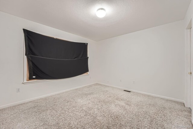 5136 S Ceylon St, Centennial, CO 80015 - carpeted empty room with a textured ceiling and baseboards